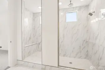 Primary bathroom with walk-in shower. Photos are of a different home. Standard finishes and features are similar and can be modified.