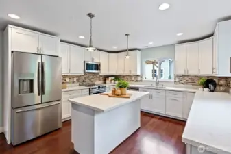 Kitchen Interior – The kitchen offers generous workspace and storage, designed for both everyday cooking and hosting.