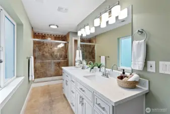 Primary Bathroom – Vanity & Shower – The primary bathroom also includes dual sinks and a walk-in shower for everyday comfort and convenience.