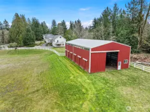 Barn Exterior Facing House – The back side of the barn looking toward the home highlights the spacious layout of the property.