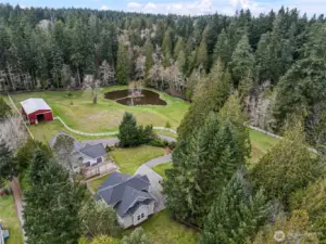 Aerial View of Property – Another aerial view highlighting the property’s open land and thoughtful layout.