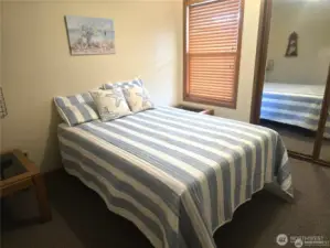 Another guest room with lighted closet
