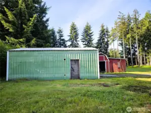 Shop garage with storage building behind.