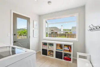 Laundry room on main floor with garden window. nice and bright with morning sun!