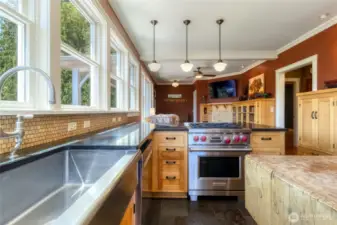 Kitchen with Farm sink, gas range & open to the Den/Family Room