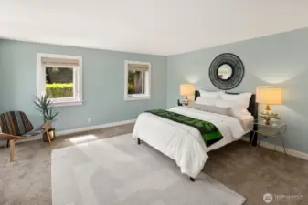 Main floor bedroom suite walks out onto the private backyard