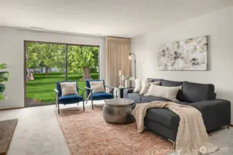 So much space in your living room and light abounds through your huge sliding door!