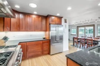 This kitchen is so bright, due to the light coming through the windows all around