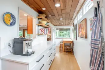 This special pass-through pantry with lots of storage and workspace will be perfect for large gatherings - set out the food and the buffet is served!