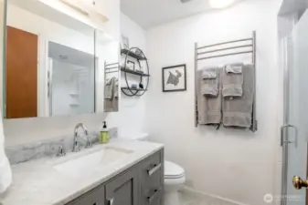 Enjoy this beautiful updated 3/4 bath on the main level on the home, with towel warmers.