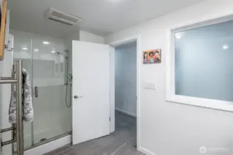 This 5 piece bathroom is just steps away from the primary bedroom on the lower level.