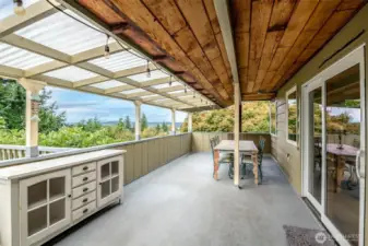 Just steps from the kitchen, this covered dining area can be used on the rainy days too!