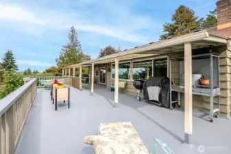 This spacious deck has room for gathering, gardening, resting and more!