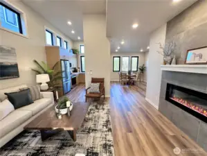 Main floor open concept with tiled electric LED fireplace
