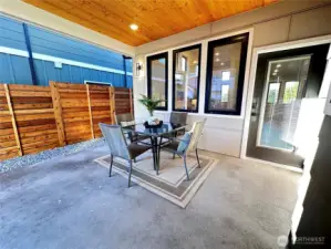Covered patio with man door access to house