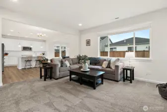 Open flow between living space and kitchen.