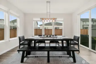 Dining room with large windows.