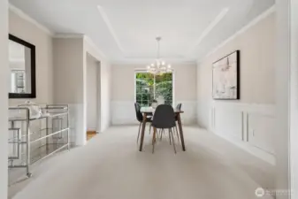 Generous formal dining room with extra space for more pieces and marvelous light fixture.