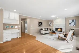 Family room shown here with the built-in desk, wood burning fireplace, and the office (5th bedroom) at the top of the photo.