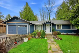 Welcoming stone pathway leading to the front door of this gorgeous home.