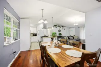 Another view of the dining area, highlighting the seamless flow into the kitchen.