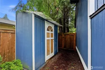 This detached storage shed offers plenty of space for garden tools, seasonal gear, and outdoor equipment.