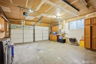 Convenient attached garage with built-in storage and workshop space to keep your gear organized.
