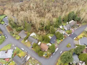 Bird's-eye perspective of the home's footprint and quiet neighborhood setting.