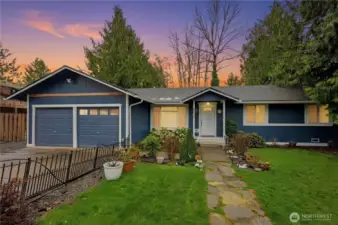 A picturesque evening view of your future home, perfectly illuminated and ready for its next chapter!