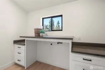 Upstairs laundry room with sink and storage