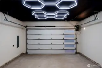 This is not your average garage! Custom lighting and paint help create showstopper garage!