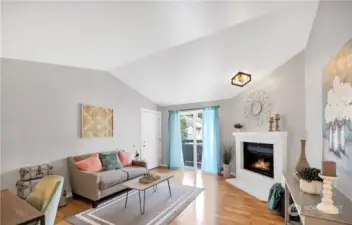 Living room. Photo includes staging, unit currently vacant.