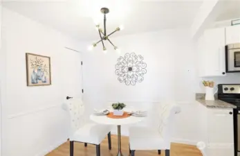 Dining area. Photo includes staging, unit currently vacant.