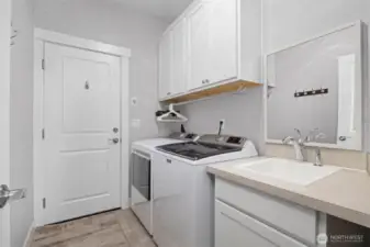 Laundry room leads to two-car garage