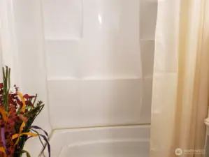 A very Nice Main Guest Bath Room Showing The Full Tub and Shower.