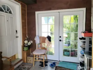 Nice Covered Enclosed Front Entry Room that leads into the Home through the Front Door and also leads to the Back Yard.