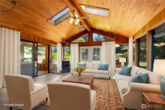 Large recreation room with pellet stove. Picture displays virtual staging.