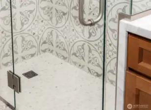 See the Brass Flowers in the Tile?