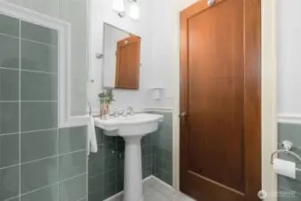 Hallway Bath right at the Entry, with Original tile work!