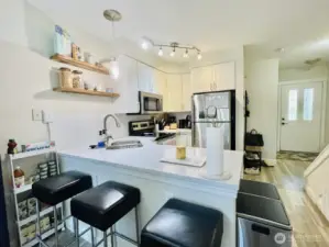 Counter top area facing towards entrance and kitchen