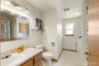 Guest full bathroom with laundry room