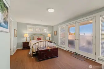 Primary bedroom with access to the deck.