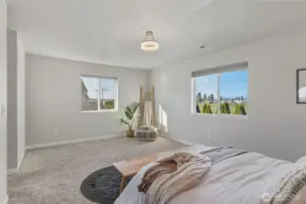 Wake up to stunning north-facing mountain views from this spacious primary suite retreat.