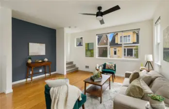 Large living area with natural light coming in through large windows.