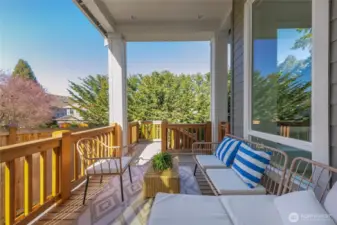 Covered deck with skylight is great for outdoor relaxation.