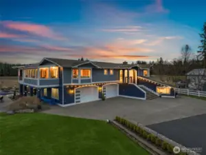 Resort-style living in Lake Stevens! Custom home with mountain views, in-ground pool + hot tub, pool house, and over 2,000 SF of covered outdoor living space.