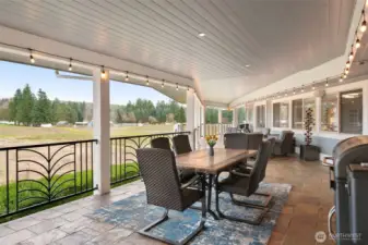 Covered balcony is perfect for gathering and entertaining.