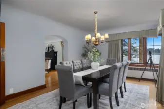 Formal dining room offers a refined setting for entertaining, complete with water views and beautifully preserved period character.