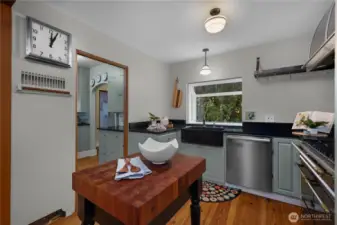 Rich textures and classic materials create a kitchen space that feels both refined and true to the era of the home.