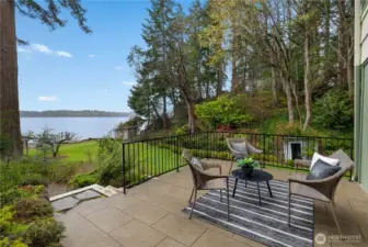 Accessed from the Lower FR - Elevated patio terrace captures peaceful water views and the beautifully maintained grounds of this rare no-bank waterfront estate.